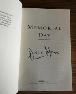 One of my copies of Memorial Day, signed by the author, Vince Flynn